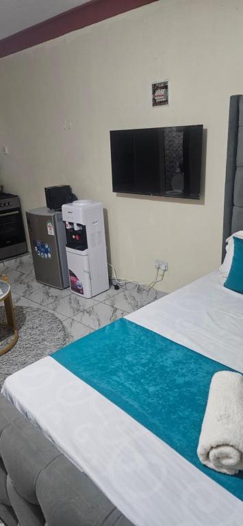 En eller flere senge i et værelse på Kevin's Homes