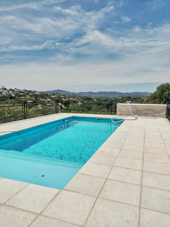 a swimming pool on top of a house at Nuestras raíces 1 in Villa Carlos Paz