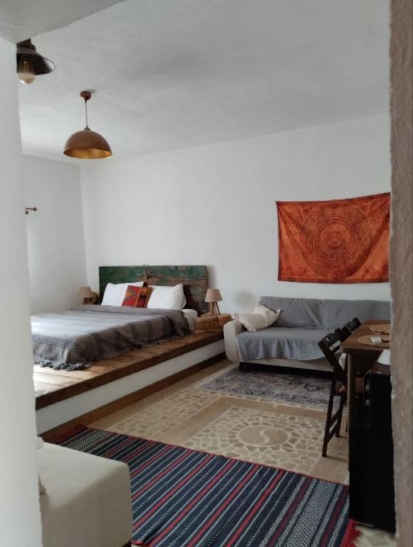 a living room with two beds and a couch at Route Cappadocia in Avanos