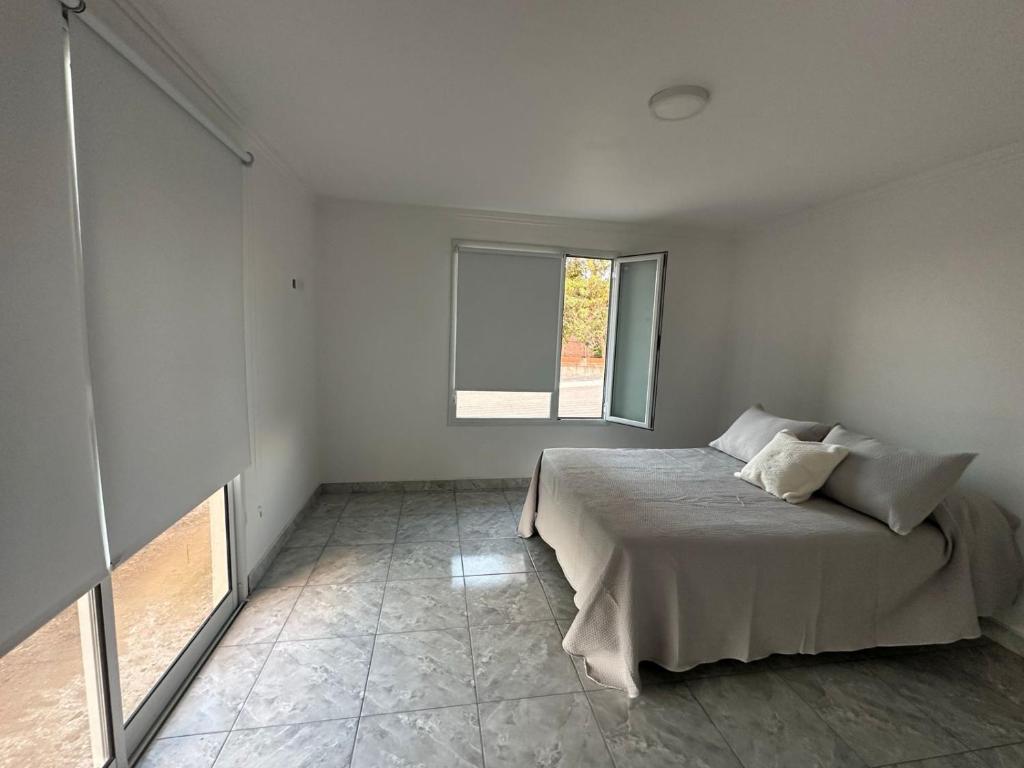 Giường trong phòng chung tại Colinas de Peralta Ramos