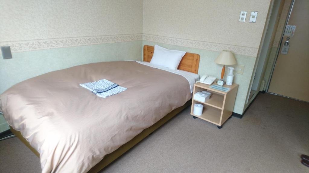 Postel nebo postele na pokoji v ubytování Hotel Himeji Hills