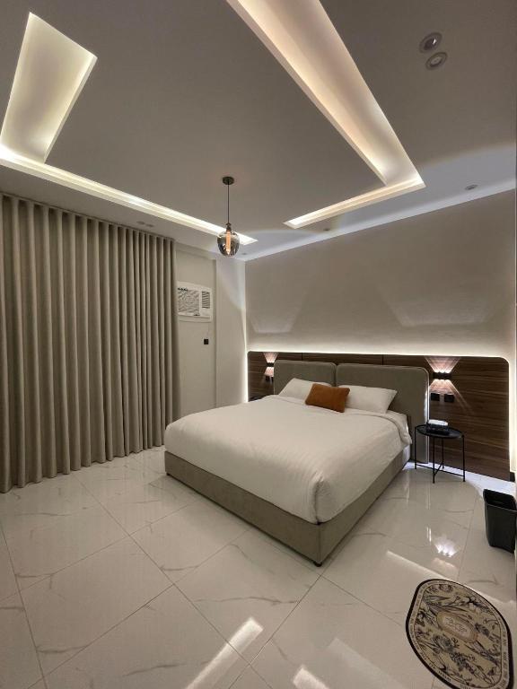 Ένα ή περισσότερα κρεβάτια σε δωμάτιο στο Lavender Amman Hotel