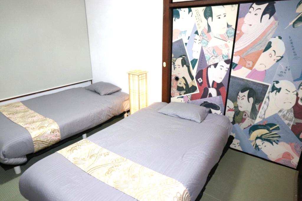 Ένα ή περισσότερα κρεβάτια σε δωμάτιο στο インジホテル下関