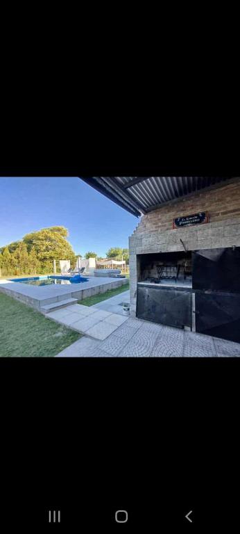 a picture of a building with a fireplace at Aires Verdes in General Pico