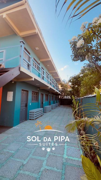 a building with a patio in front of it at Sol da pipa - suítes in Pipa