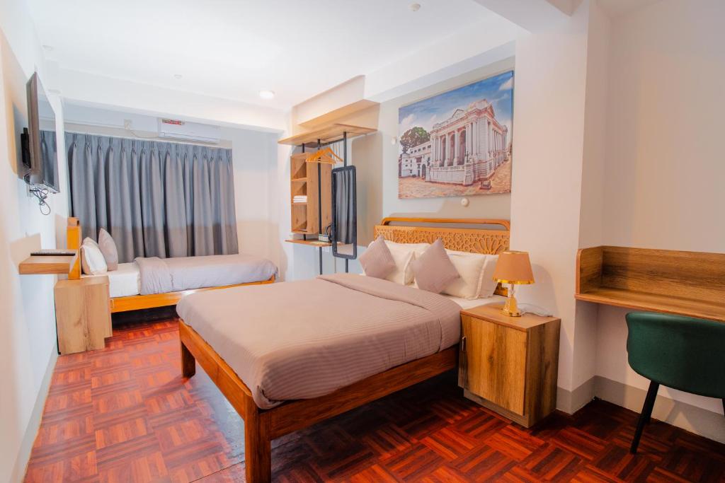 Postel nebo postele na pokoji v ubytování Checkpoint KTM Hostel