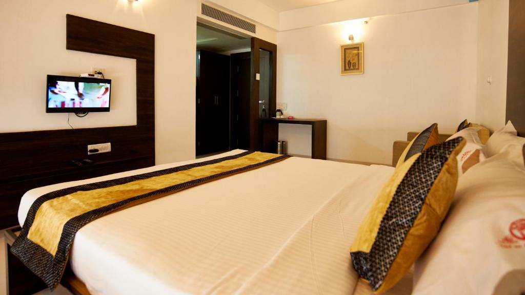 Postel nebo postele na pokoji v ubytování Hotel Golden View