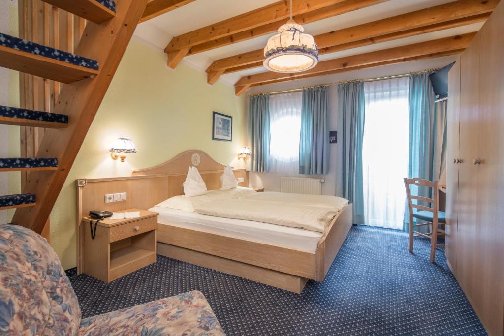 Postel nebo postele na pokoji v ubytování Hotel Amaten