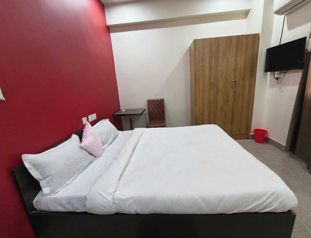 Postel nebo postele na pokoji v ubytování Hotel O B. S Marriage Palace