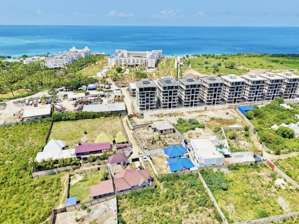 an aerial view of a resort with the ocean in the background at Swahili lodge nungwi in Kinyasini