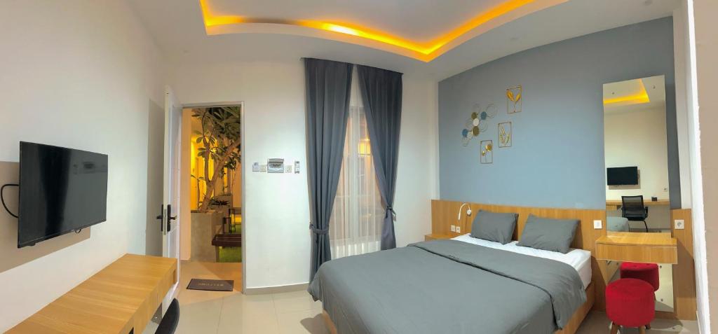 TV a/nebo společenská místnost v ubytování studio suryajingga