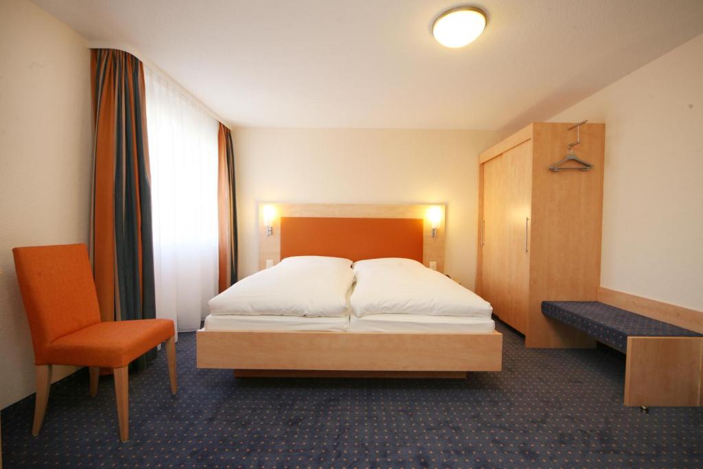Postel nebo postele na pokoji v ubytování Hotel Buchserhof
