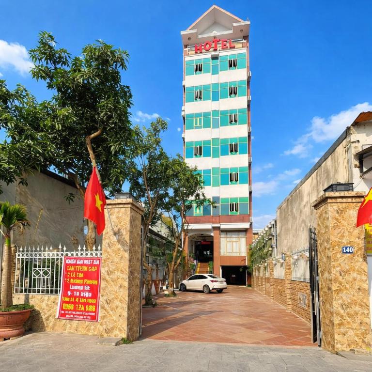 a building with a sign in front of a building at Nhật Tân Hotel in Hanoi