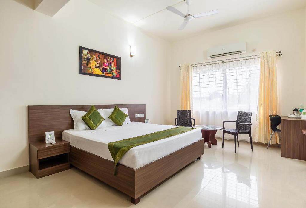 Ένα ή περισσότερα κρεβάτια σε δωμάτιο στο Treebo Trend Pappilon Palace