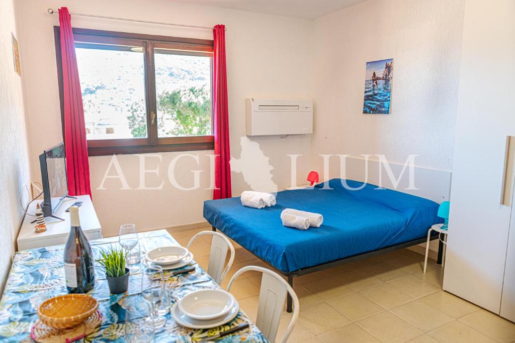 Giường trong phòng chung tại Pesciolino Rosso