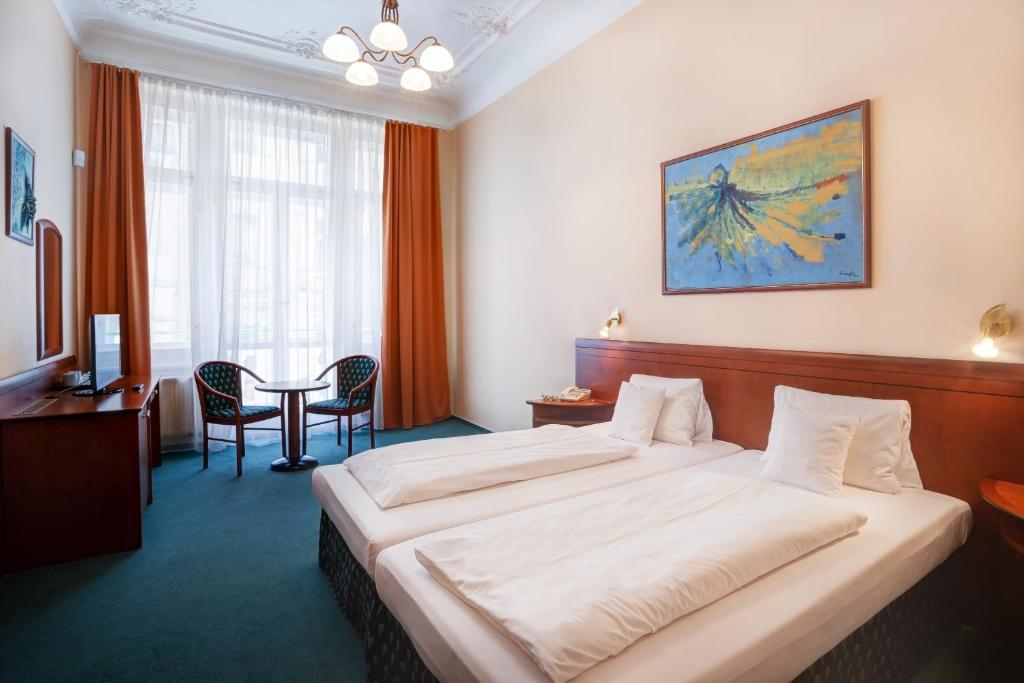 Postel nebo postele na pokoji v ubytování Hotel Westend