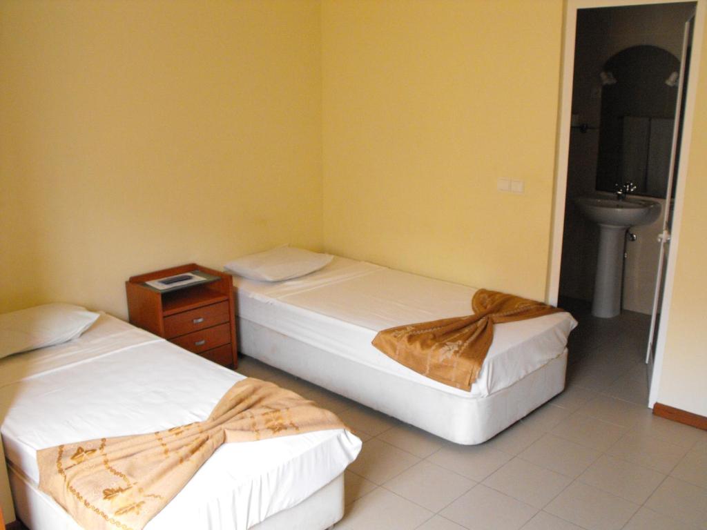Postel nebo postele na pokoji v ubytování Hotel Lazareto