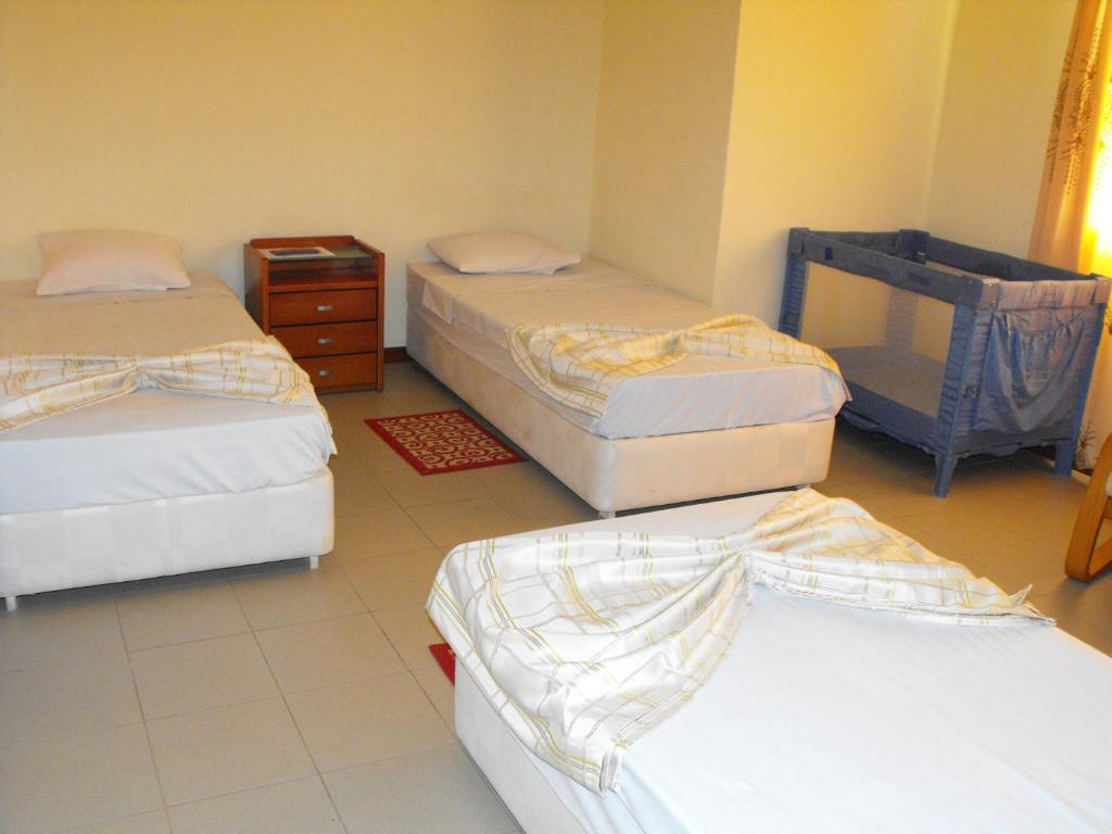 Postel nebo postele na pokoji v ubytování Hotel Lazareto