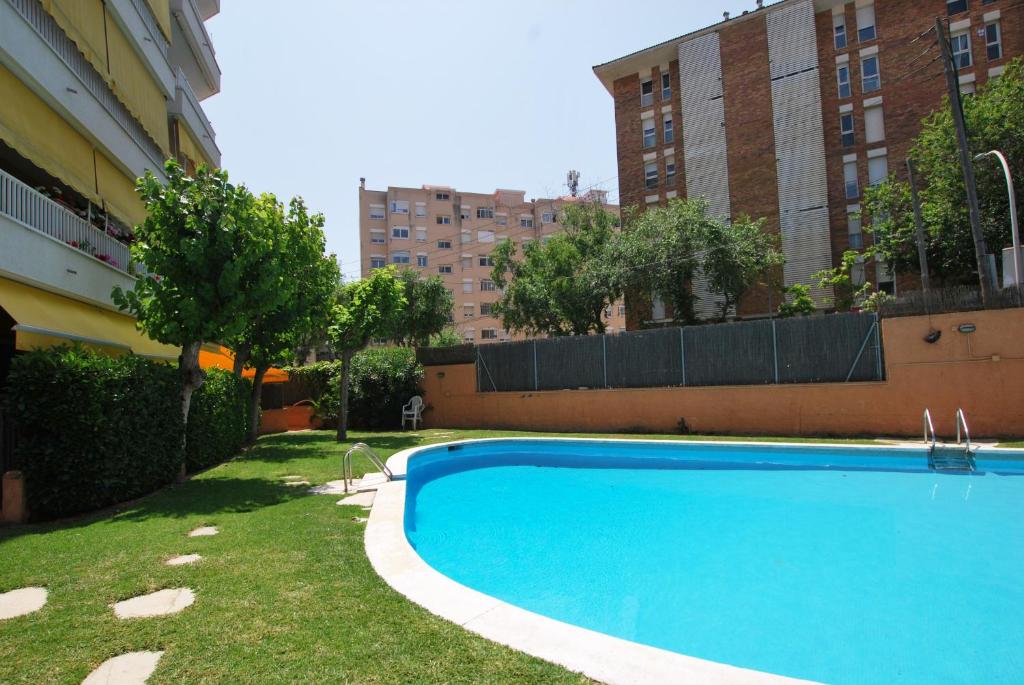 a swimming pool in the yard of a building at Narciso views in Vilassar de Mar