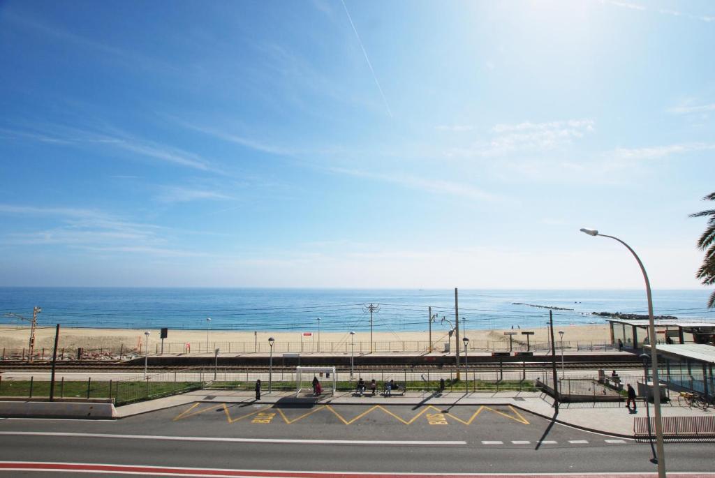 an empty parking lot next to the beach at Cami Ral in Premiá de Mar