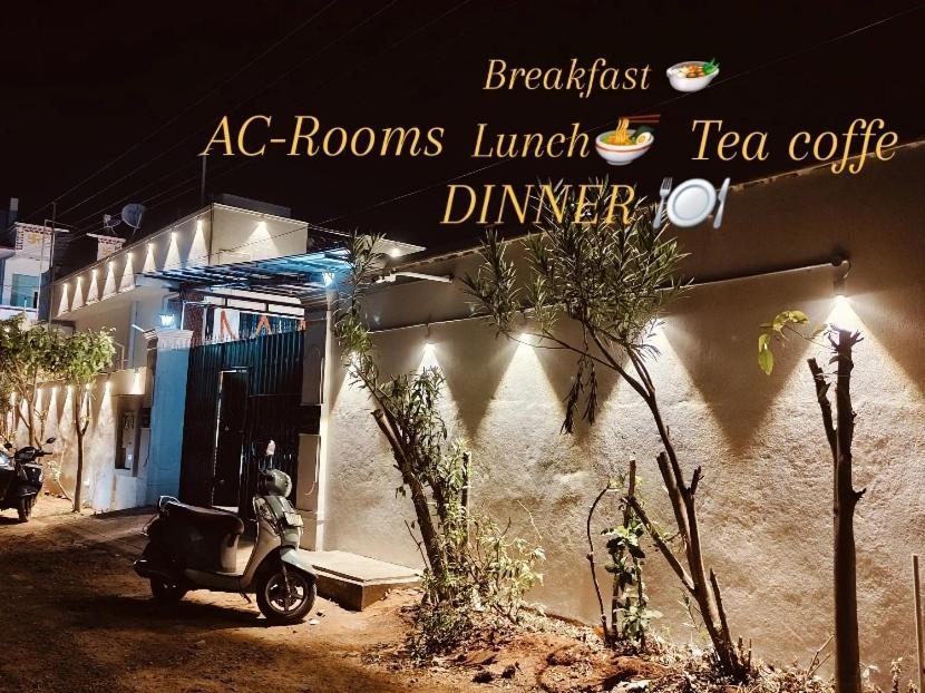 a scooter parked in front of a tea cafe at La Goodwill Garden Luxury -pondicherry in Auroville