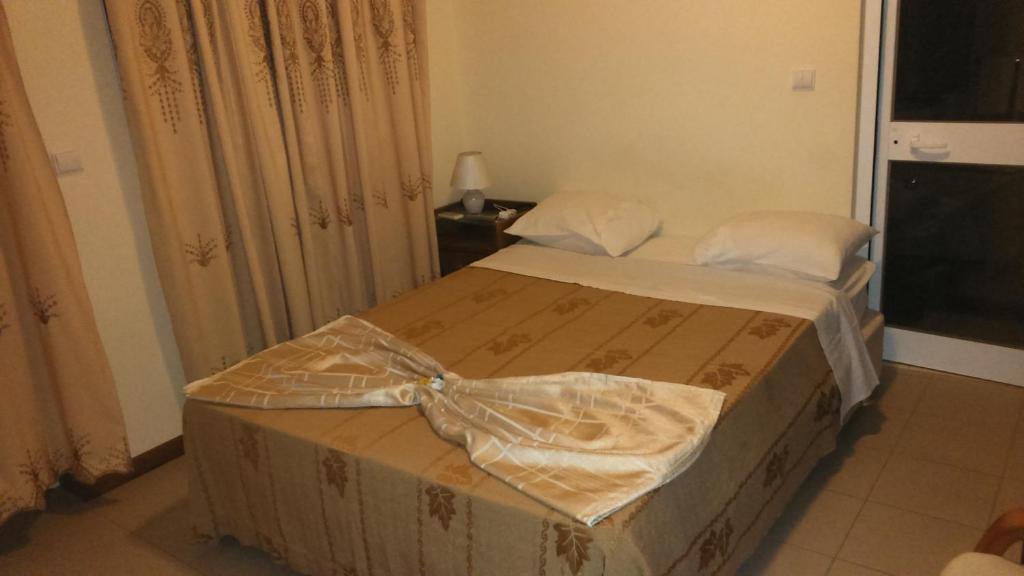 Postel nebo postele na pokoji v ubytování Hotel Lazareto