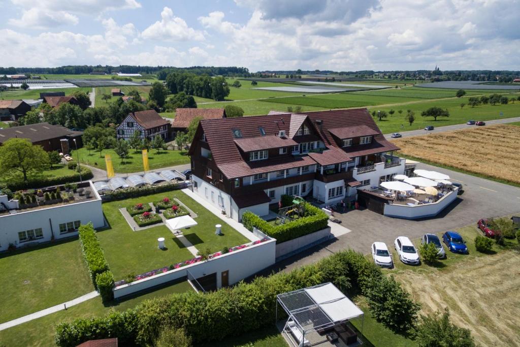 an aerial view of a large house with a yard at Seemöwe Swiss Quality Hotel in Güttingen