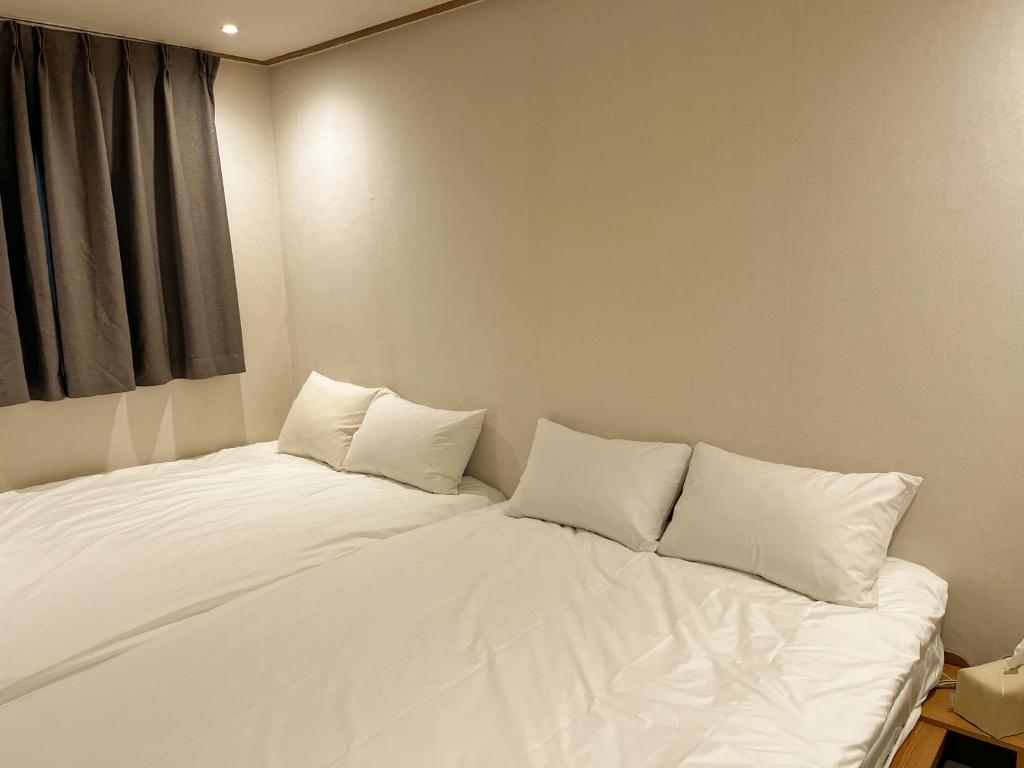 Giường trong phòng chung tại STAYV 스테이브 장안 - cozy room in 답십리 동대문