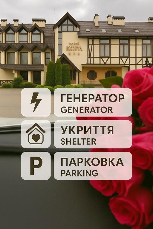 a group of street signs in front of a house at Hotel Kopa - Lviv in Lviv