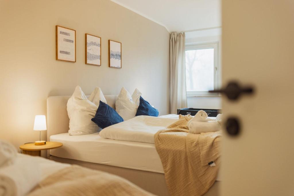 Postel nebo postele na pokoji v ubytování HYGGE HOMES - Apartment 'Lilla Lycka'