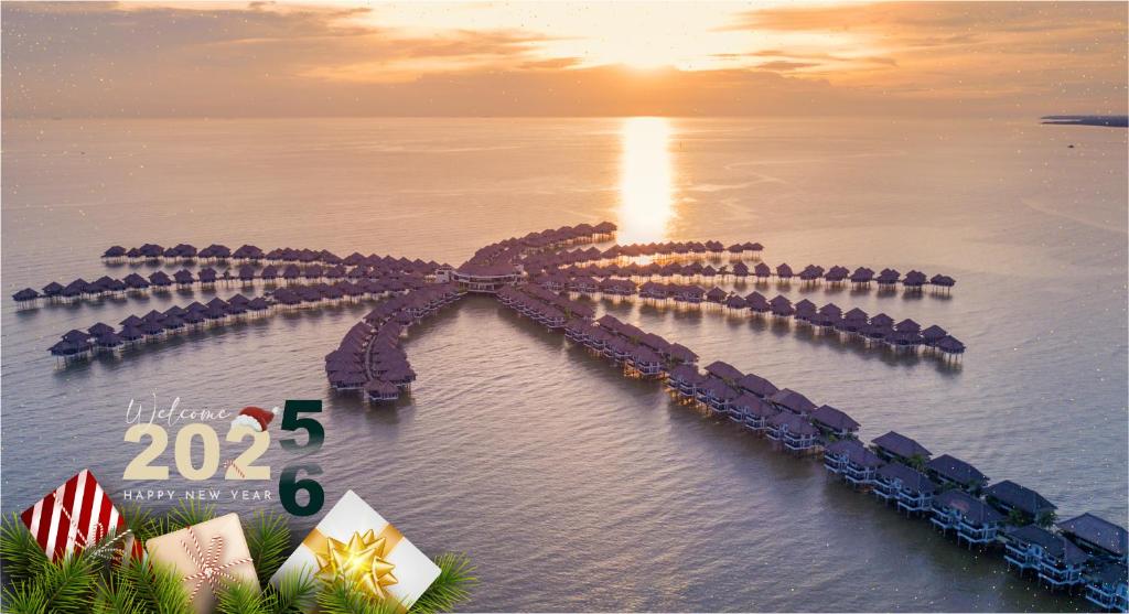 an aerial view of a pier in the water at Golden Palm Tree Sepang in Sepang