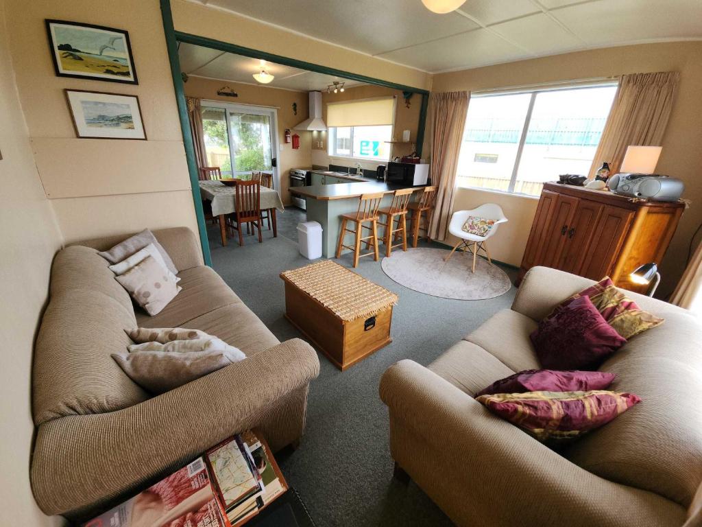 Et opholdsområde på Esplanade Escape Classic Coastal Cottage