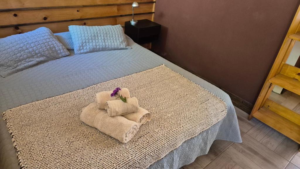 En eller flere senge i et værelse på La Insolente