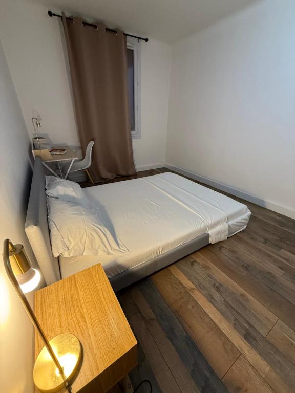 En eller flere senge i et værelse på Chambre hôtes