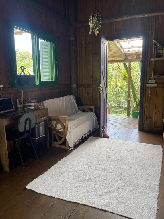 En eller flere senge i et værelse på CASINHA de MADEIRA ACONCHEGANTE