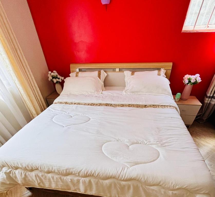 En eller flere senge i et værelse på Natasha's cozy corner