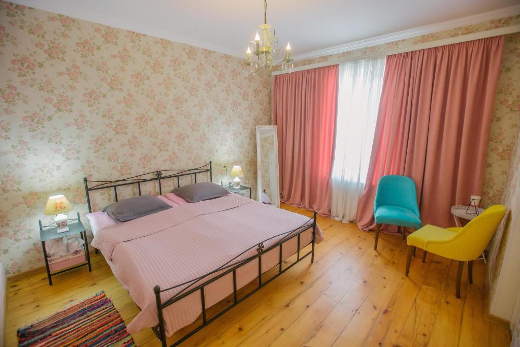 Postel nebo postele na pokoji v ubytování Nino's House