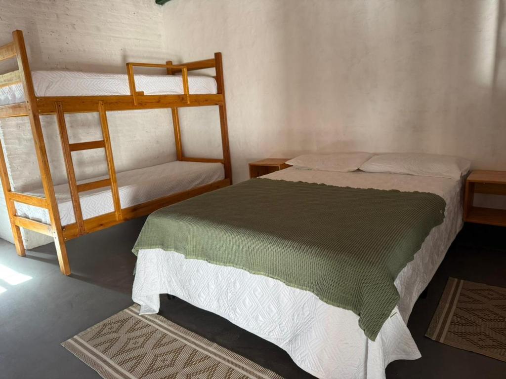 Postel nebo postele na pokoji v ubytování El Cacique Host