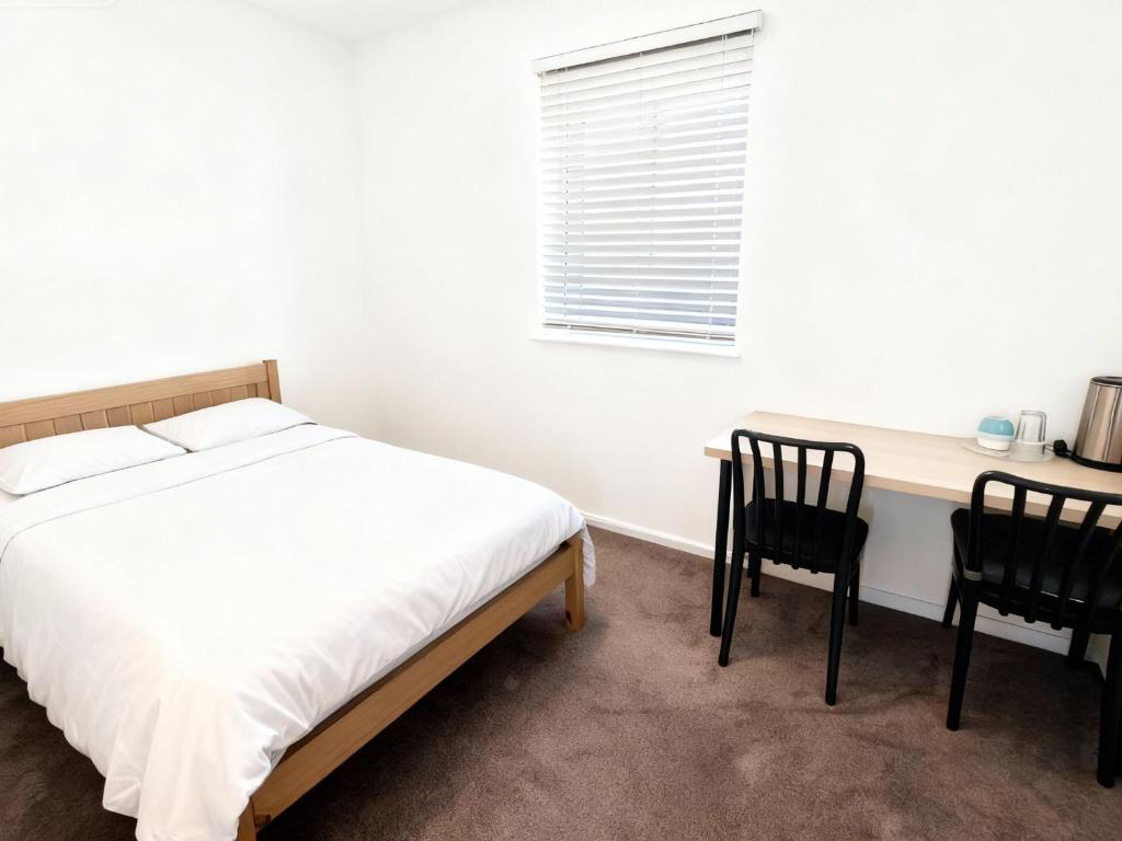 Postel nebo postele na pokoji v ubytování Kensington Times River Residence