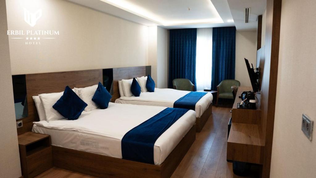 Postel nebo postele na pokoji v ubytování Erbil Platinum Hotel