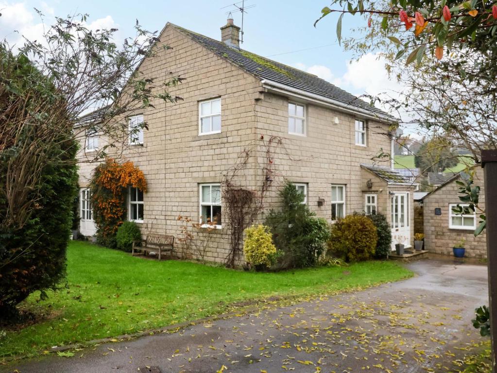 a large brick house with a driveway at Lair Close House in Harrogate