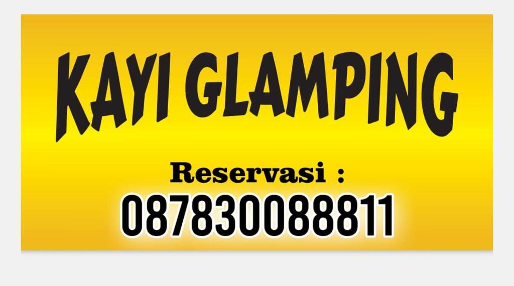 a yellow sign with the words kx changing andresynthesis at Kayi glamping in Kaliurang