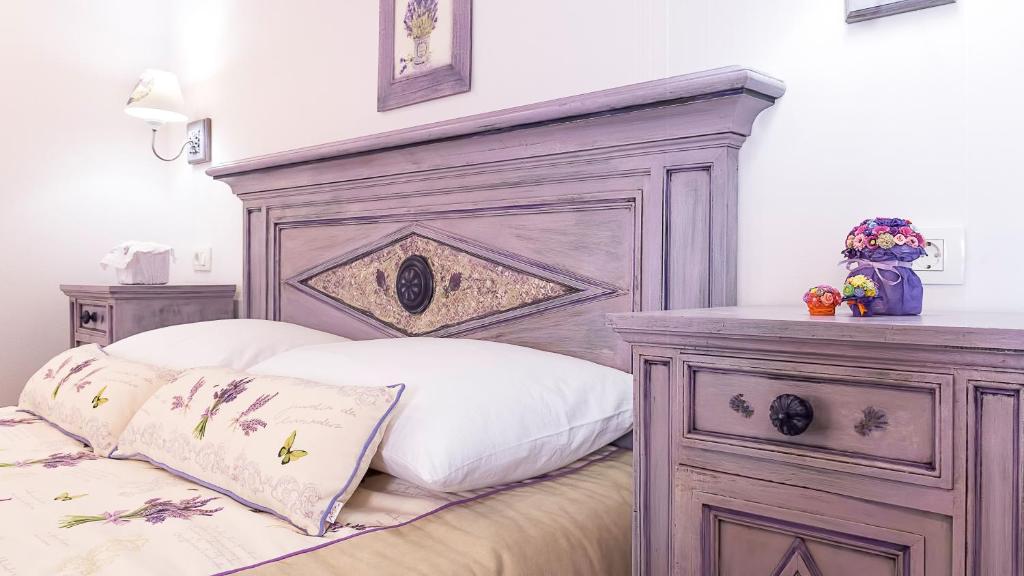 Postel nebo postele na pokoji v ubytování Boutique Cardea