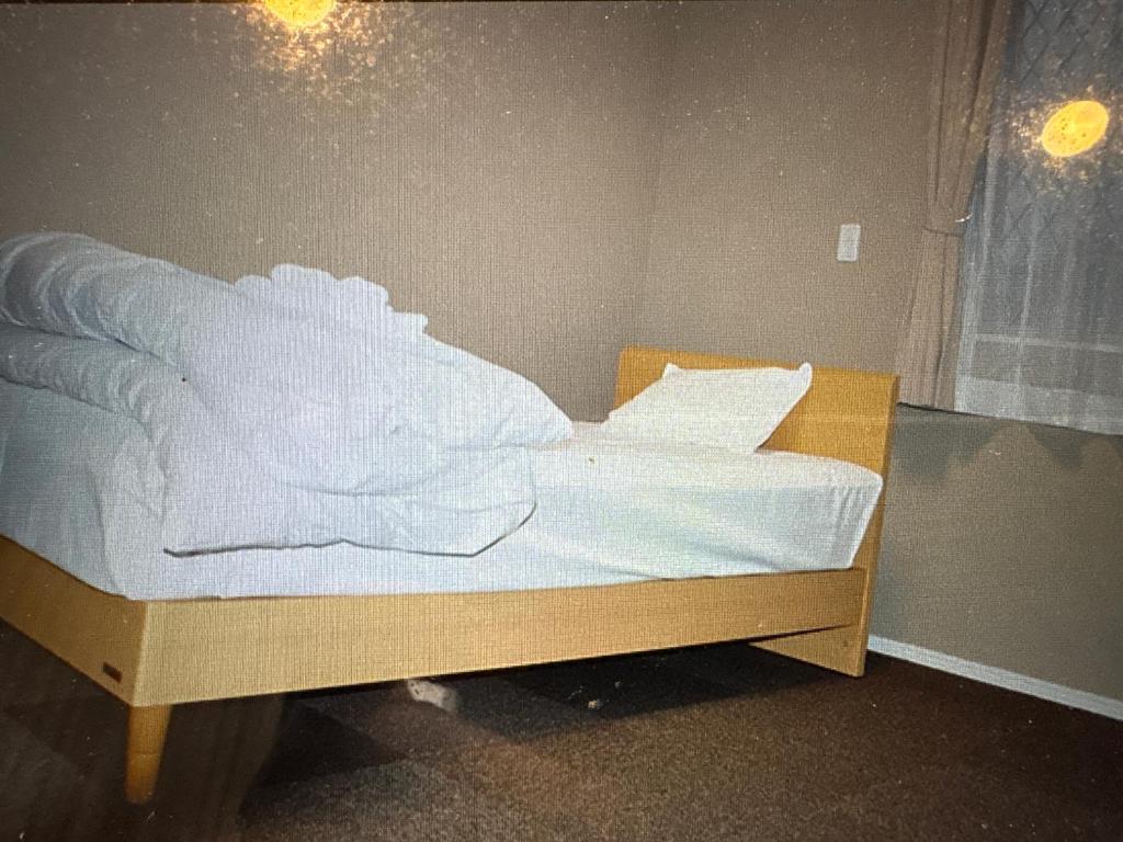 Postel nebo postele na pokoji v ubytování ビジネスホテル八幡