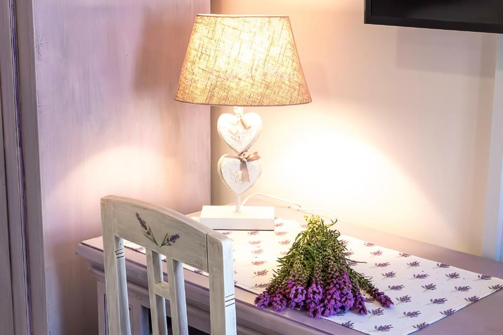 Postel nebo postele na pokoji v ubytování Boutique Cardea