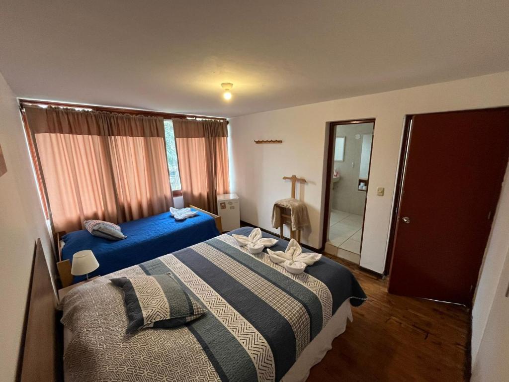 Postel nebo postele na pokoji v ubytování Harmony Inn Miraflores