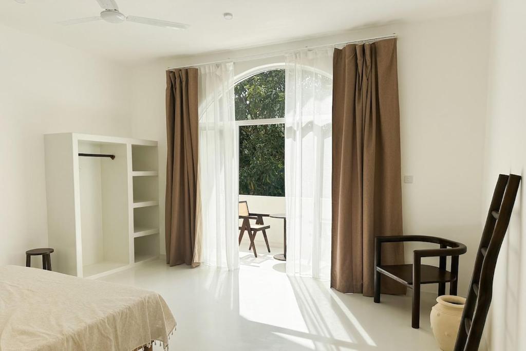 En eller flere senge i et værelse på Soleya Boutique Villa