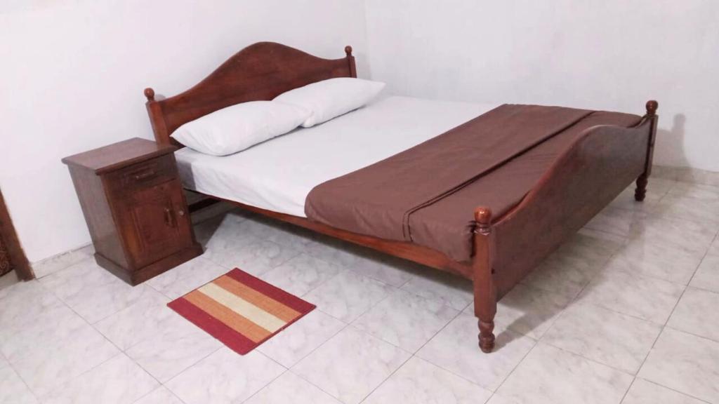 Giường trong phòng chung tại New Moon