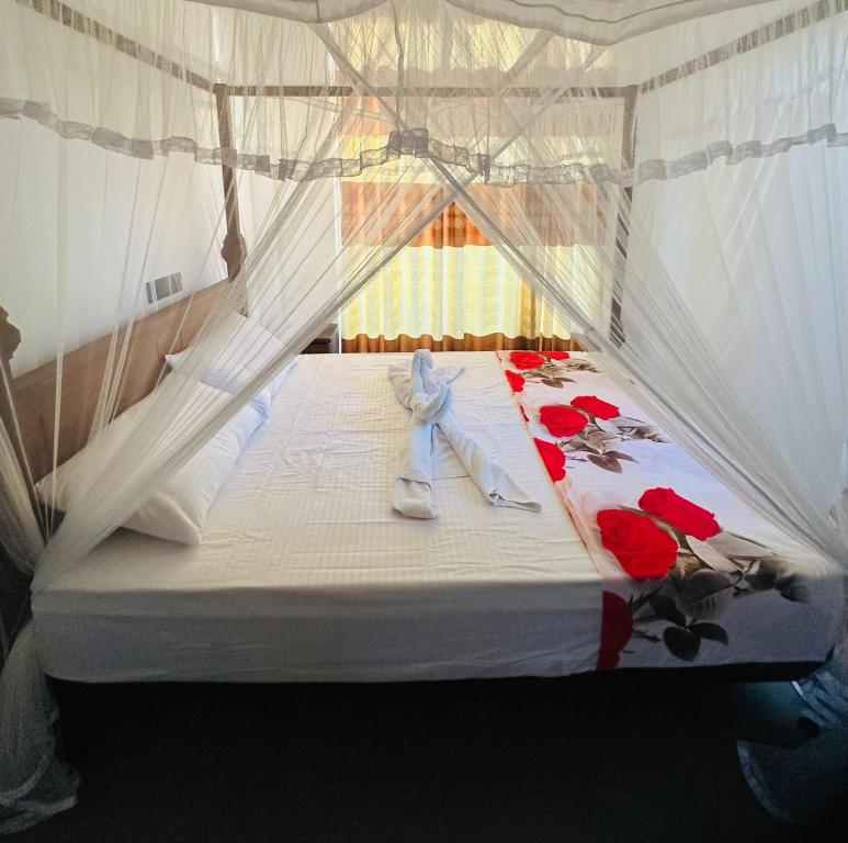 Postel nebo postele na pokoji v ubytování Lyra Mirissa