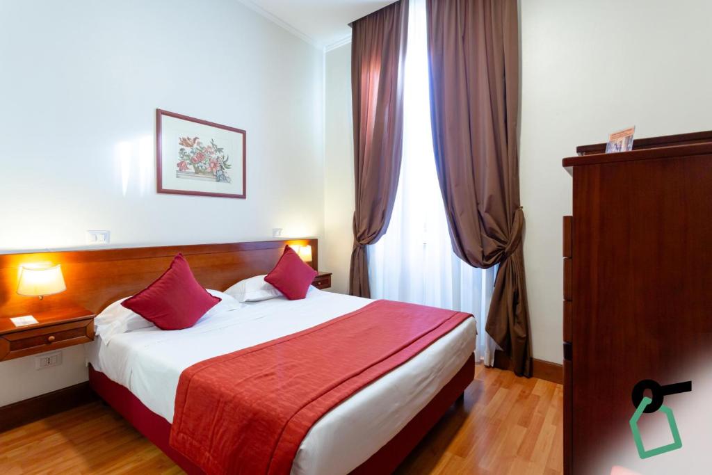 En eller flere senge i et værelse på Hotiday Roma Borghese